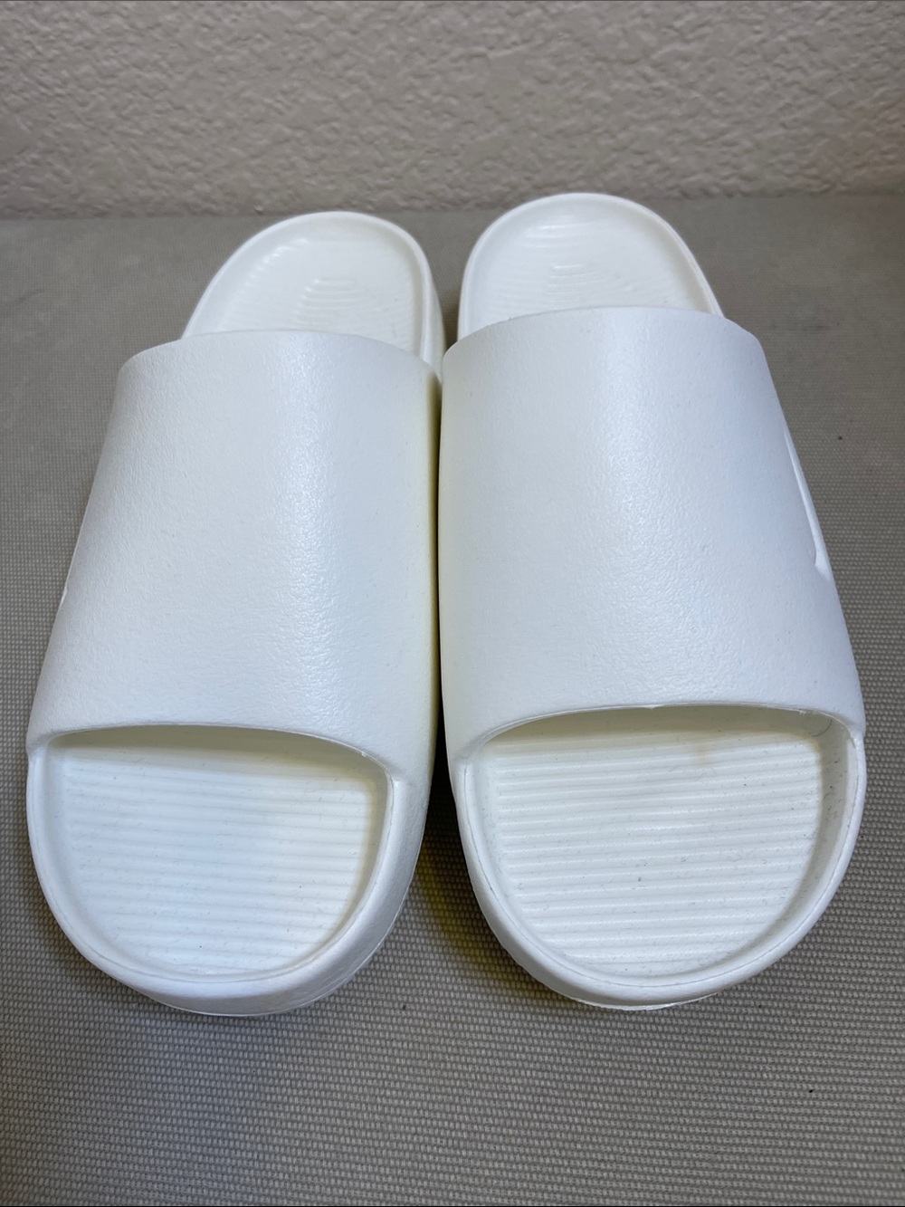 Nike Calm   White Slide Sandals - Embossed with Nike Swoosh